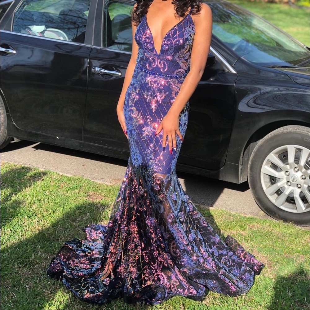 This beautiful dress is from glitz. It’s a size 0